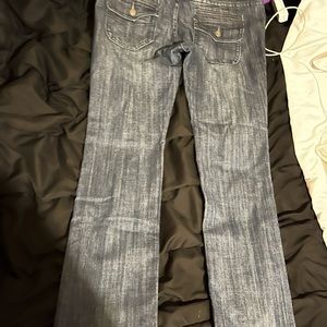 Vigoss I know says skinny but more straight leg, and flap butt pocket